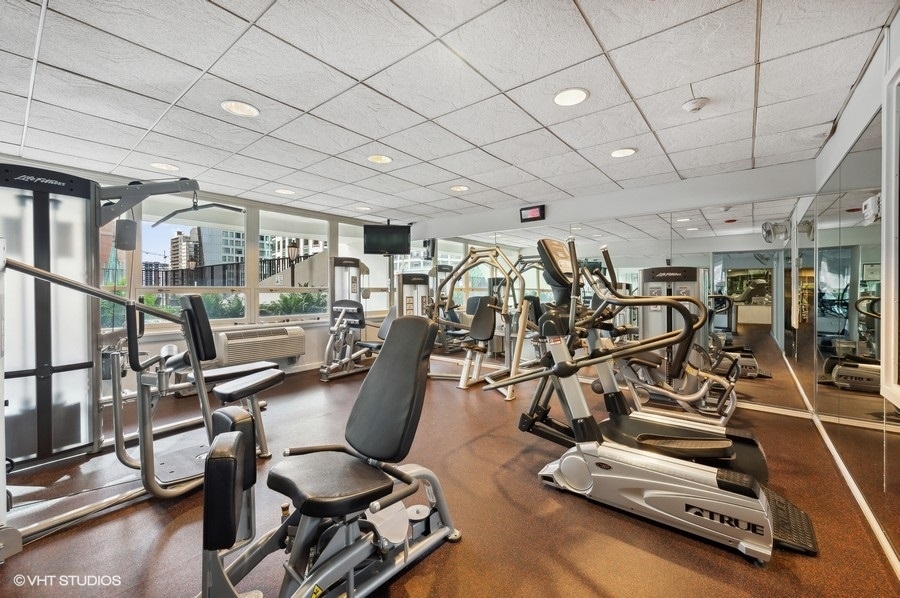 111 East Chestnut Street, Unit 14K Chicago, IL 60611 - Photo 20 of 20 a view of a room with gym equipment