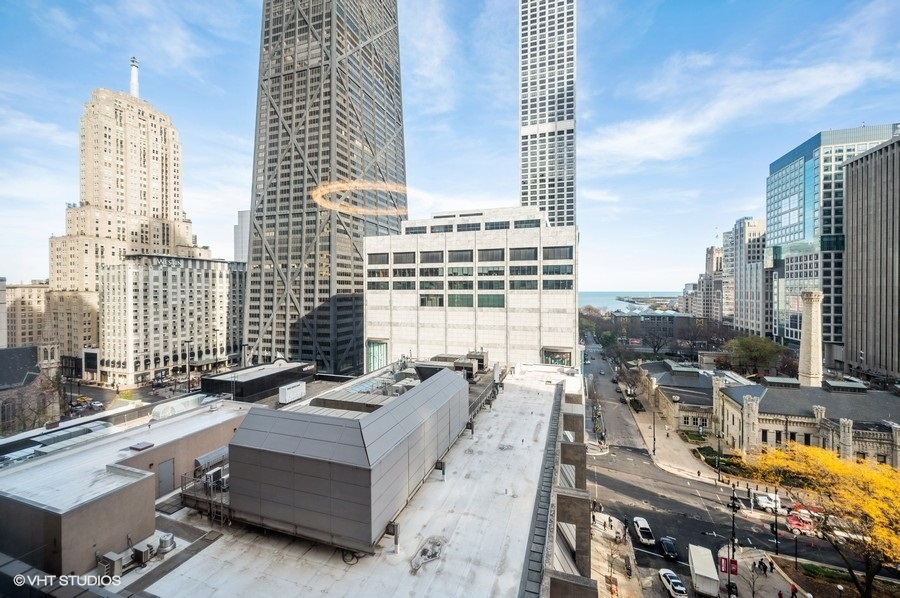 111 East Chestnut Street, Unit 14K Chicago, IL 60611 - Photo 5 of 20 a view of roof deck with outdoor seating and city view