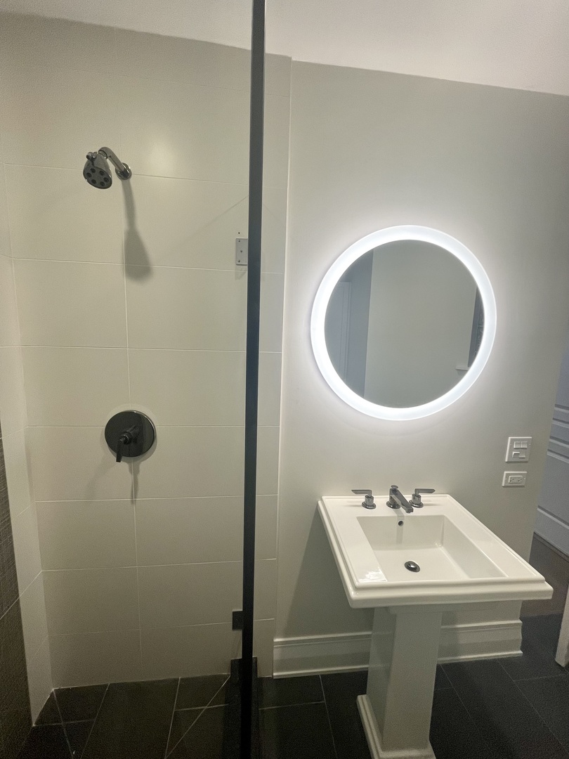 2539 West Iowa Street, Unit 3 Chicago, IL 60622 - Photo 11 of 19 a bathroom with a sink toilet and a mirror