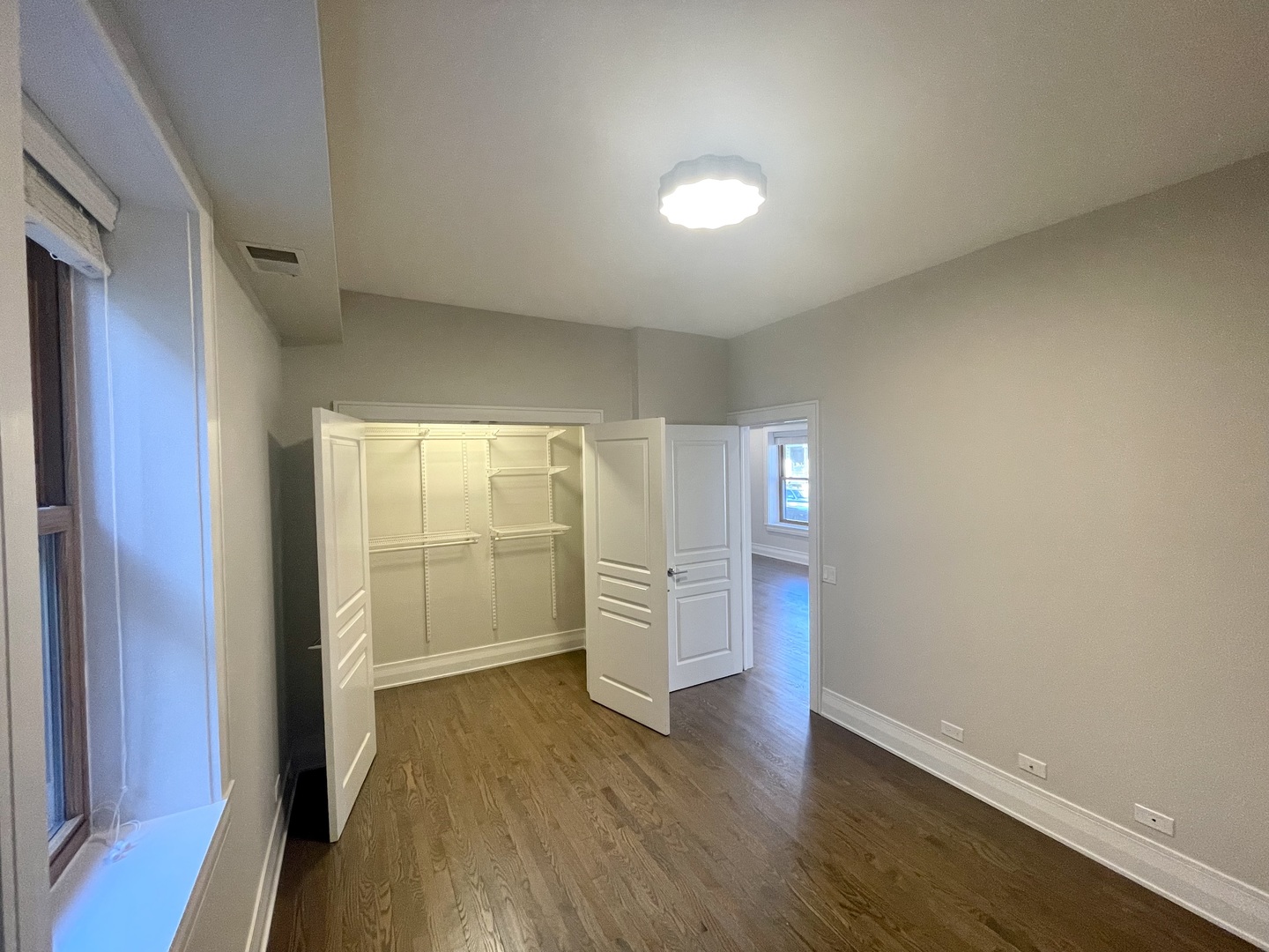 2539 West Iowa Street, Unit 3 Chicago, IL 60622 - Photo 14 of 19 wooden floor in an empty room with a window