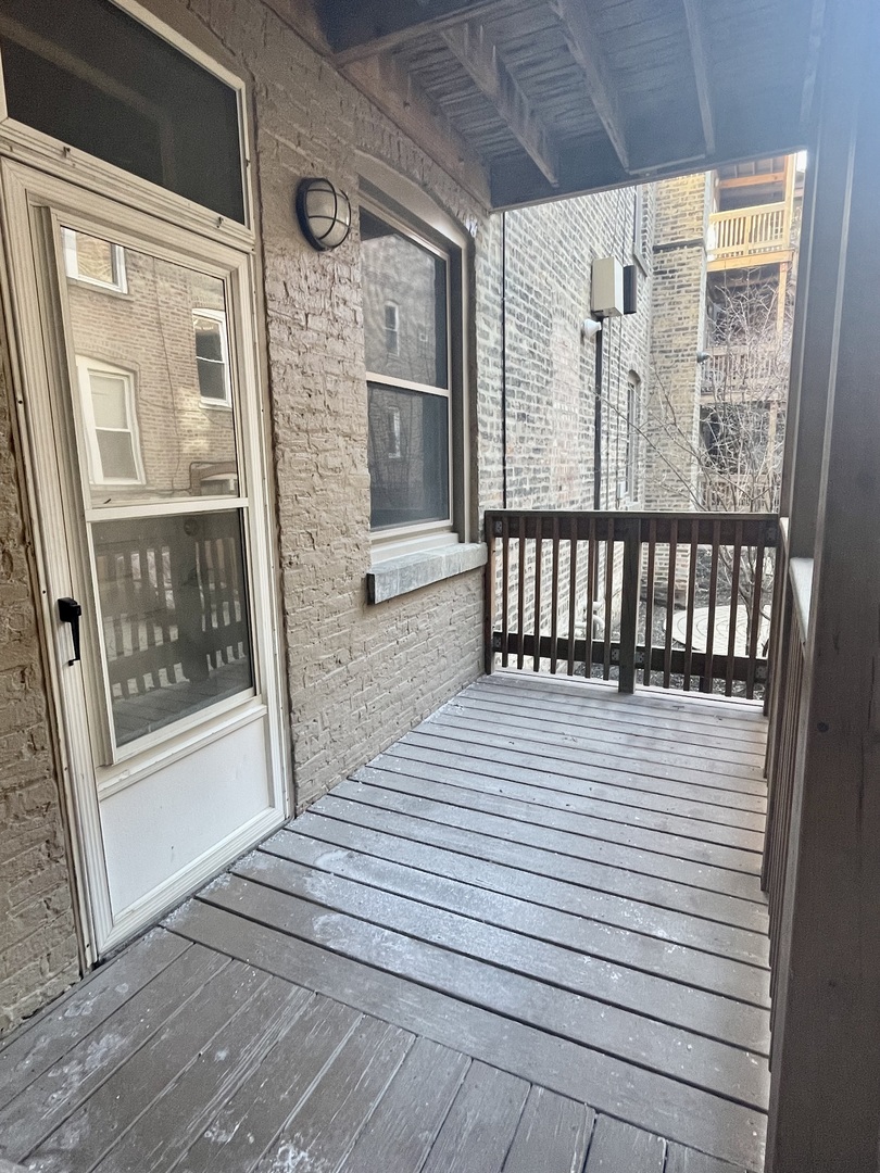 2539 West Iowa Street, Unit 3 Chicago, IL 60622 - Photo 15 of 19 a view of a balcony with wooden floor