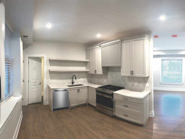 2539 West Iowa Street, Unit 3 Chicago, IL 60622 - Photo 8 of 19 a kitchen with white cabinets and white appliances