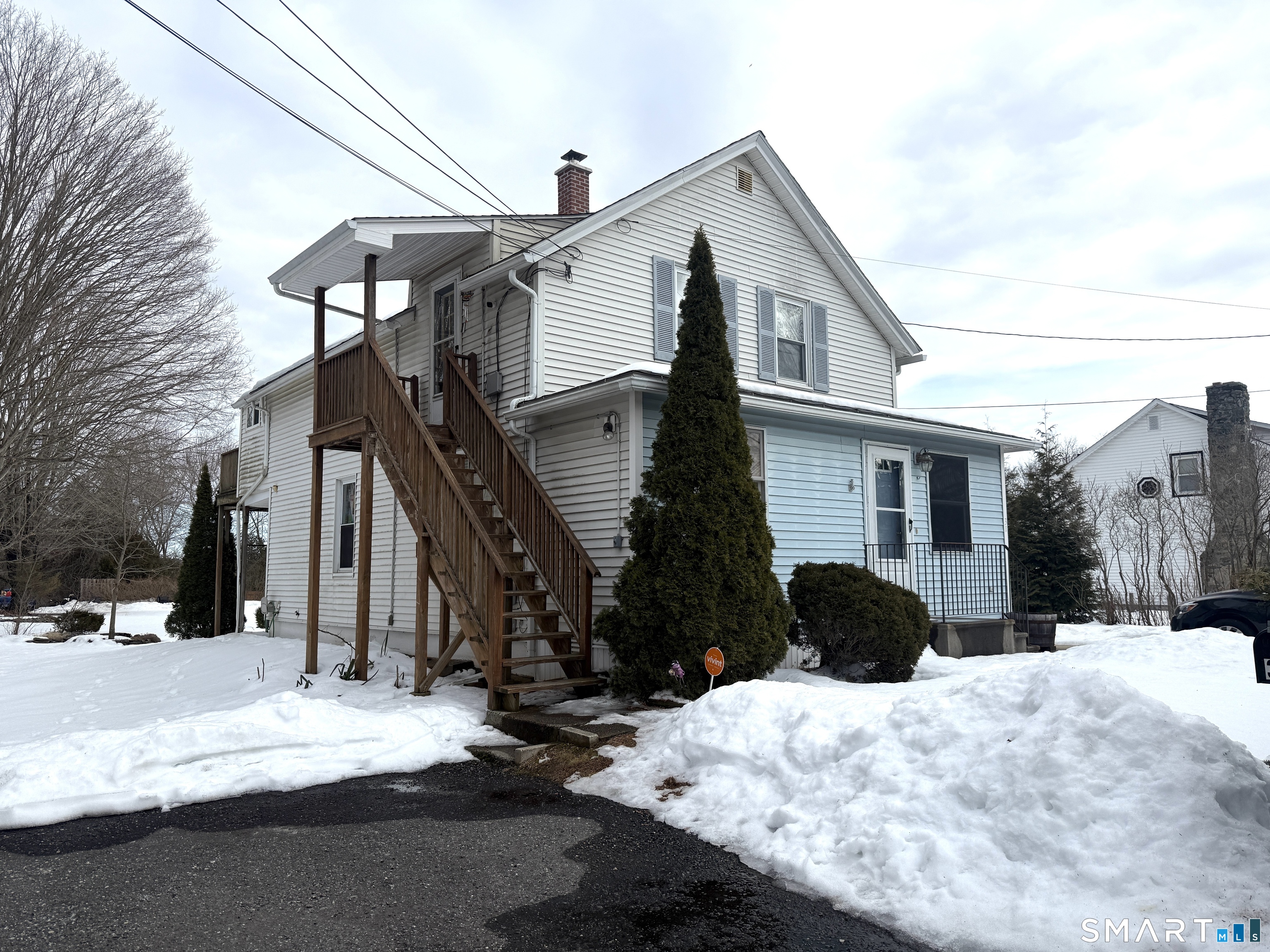 a view of a house covered in snow
