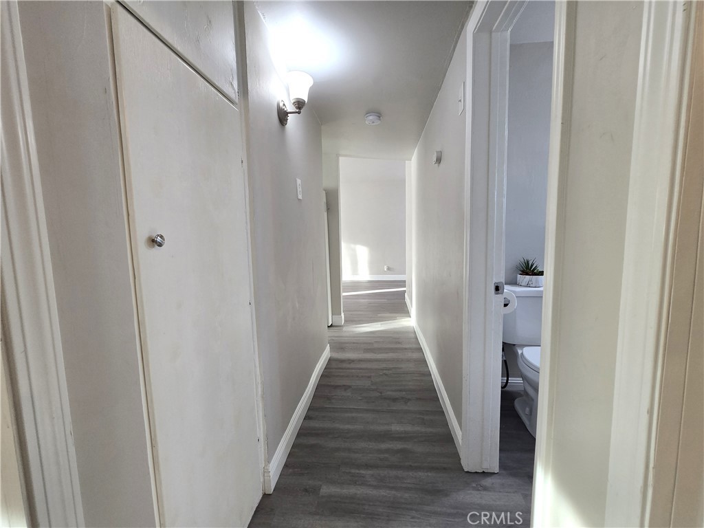 2140 Mahoney Drive Bakersfield, CA 93307 - Photo 15 of 16 a view of a hallway with a wooden floor