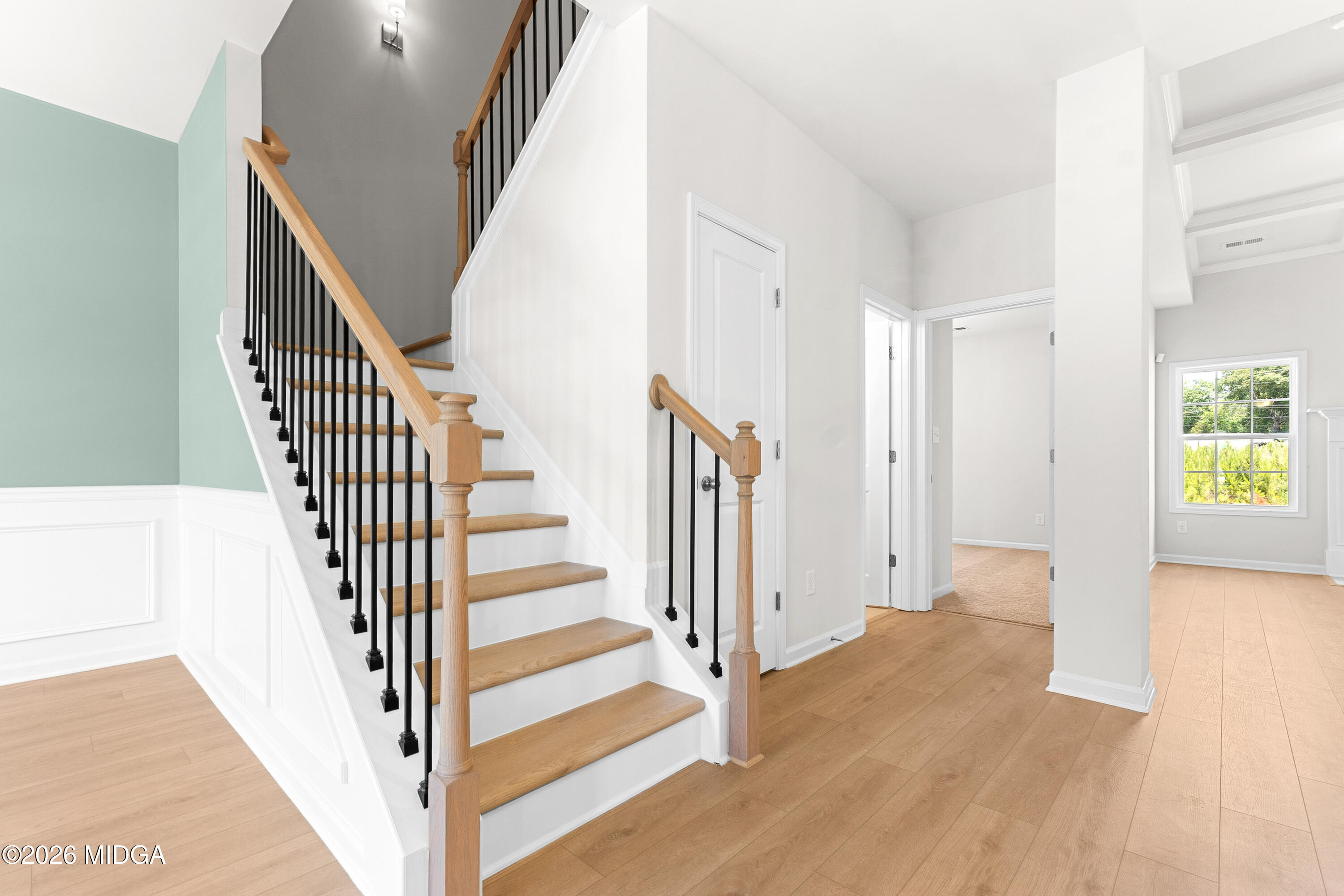 5393 Felles Way, Unit 359 Forsyth, GA 31029 - Photo 2 of 54 a view of a hallway with wooden floor and entryway