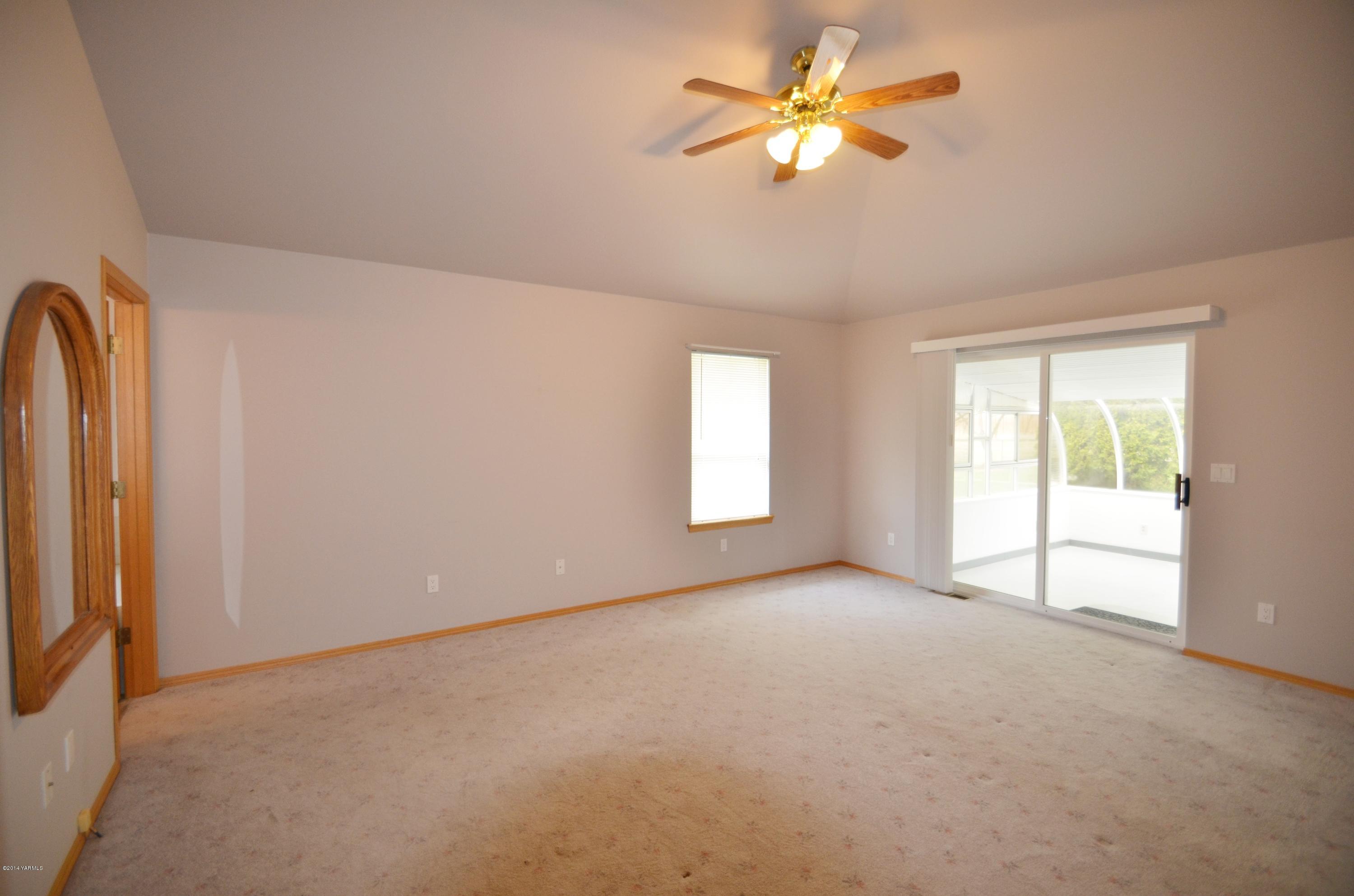 5405 Postma Road Yakima, WA 98901 - Photo 11 of 31 wooden floor in an empty room with a window