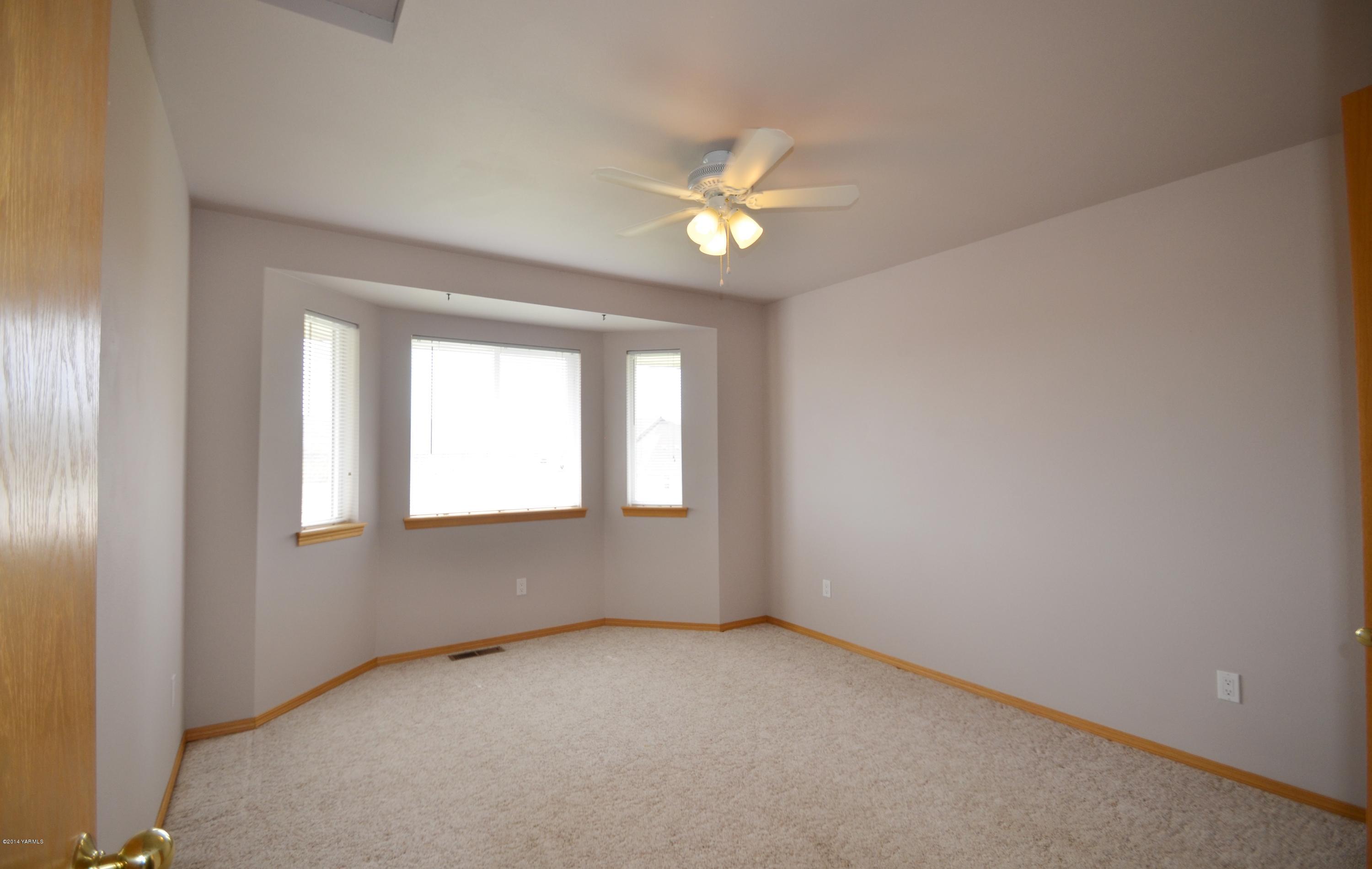 5405 Postma Road Yakima, WA 98901 - Photo 14 of 31 an empty room with a window
