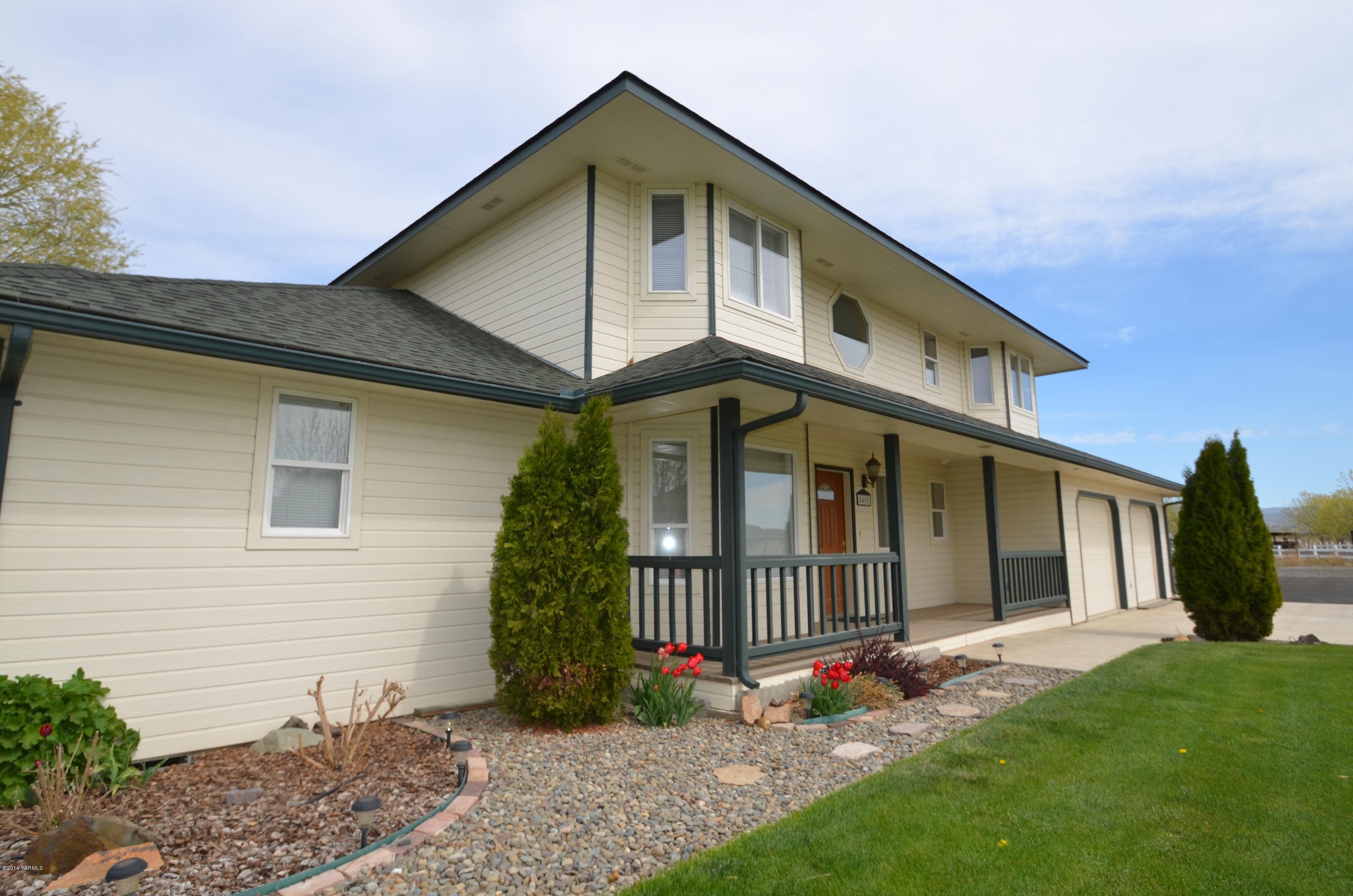 5405 Postma Road Yakima, WA 98901 - Photo 3 of 31 a view of a house with a yard and plants