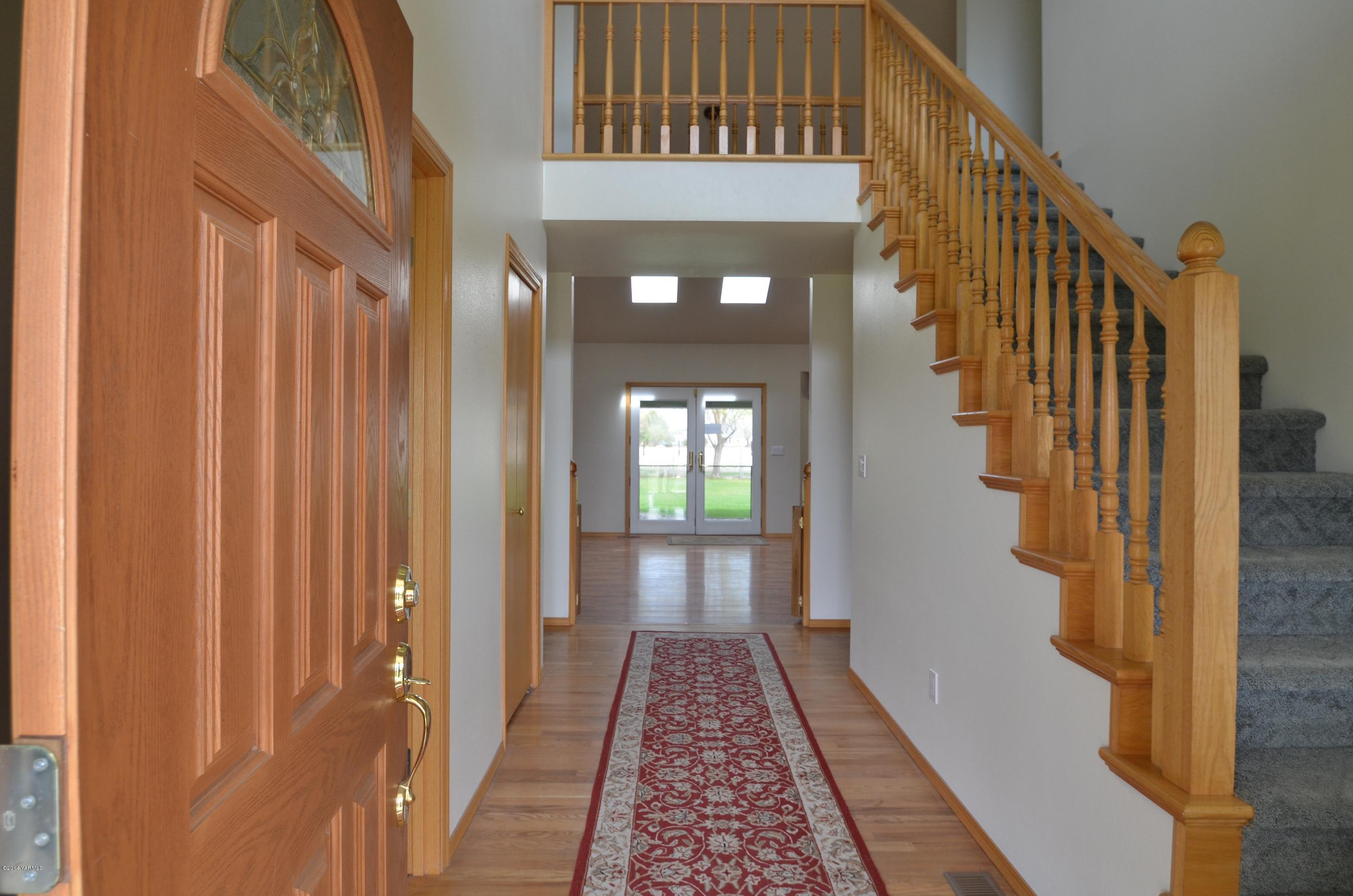 5405 Postma Road Yakima, WA 98901 - Photo 4 of 31 a view of a hallway with wooden floor and staircase