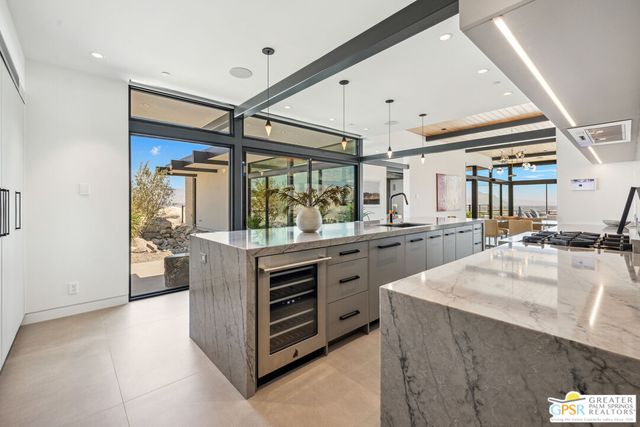 a bedroom with double bed and a large window