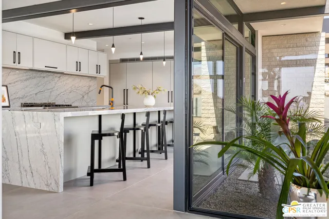 a bedroom with double bed and a large window