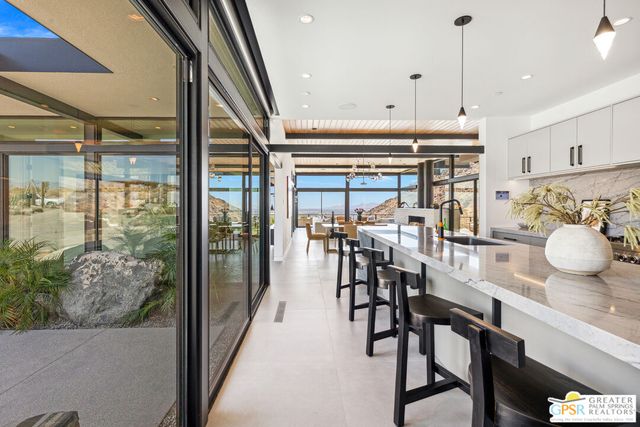 a bedroom with a large bed and a balcony view