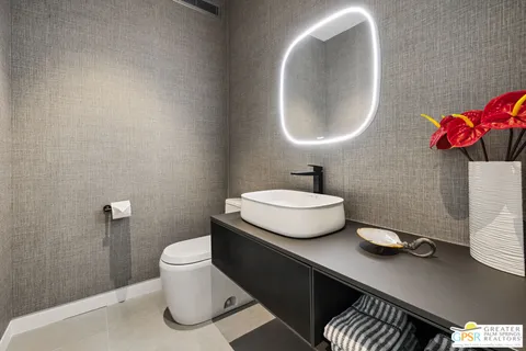 a view of a patio with table and chairs with wooden floor and fence