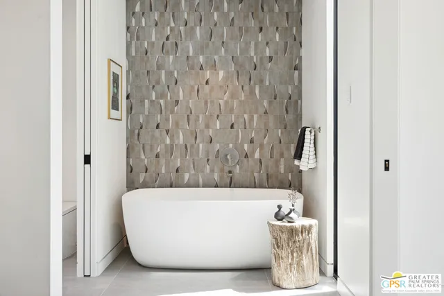 a view of a terrace with couches and wooden floor