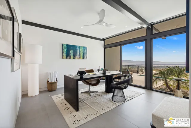 a view of swimming pool with seating space