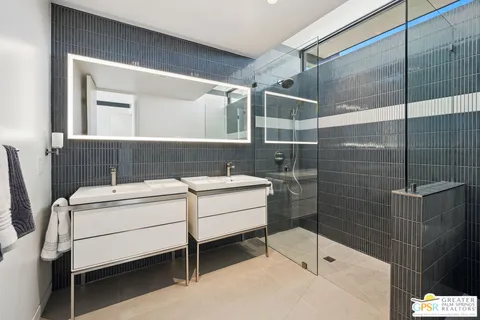 a view of a balcony with chairs and wooden floor