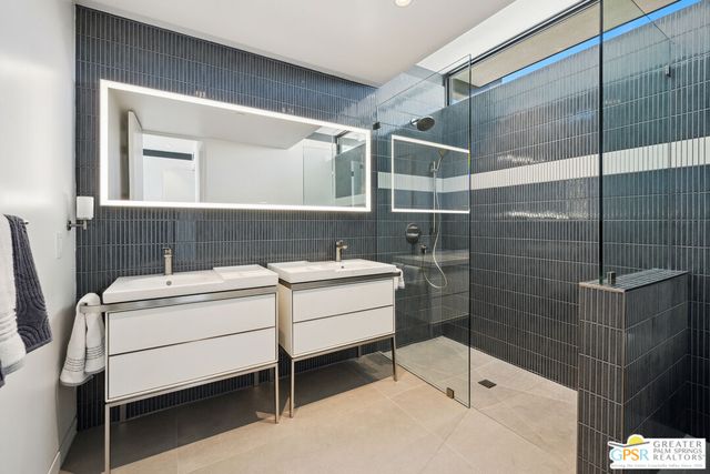 a view of a balcony with chairs and wooden floor