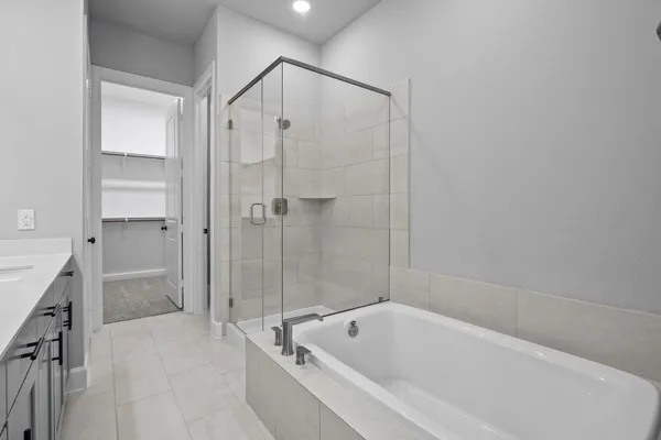 a bathroom with a bathtub and a shower