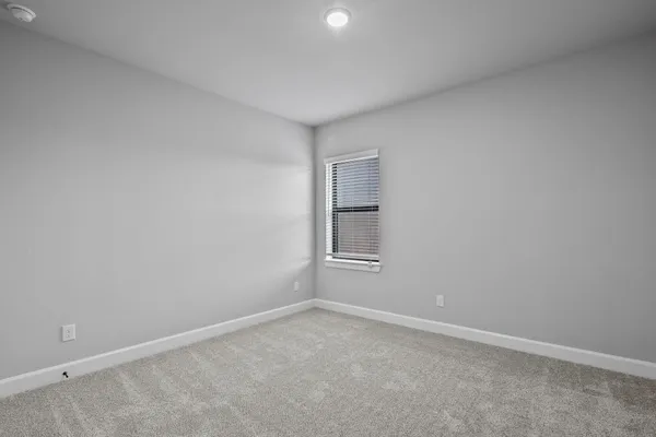 an empty room with a empty space and window