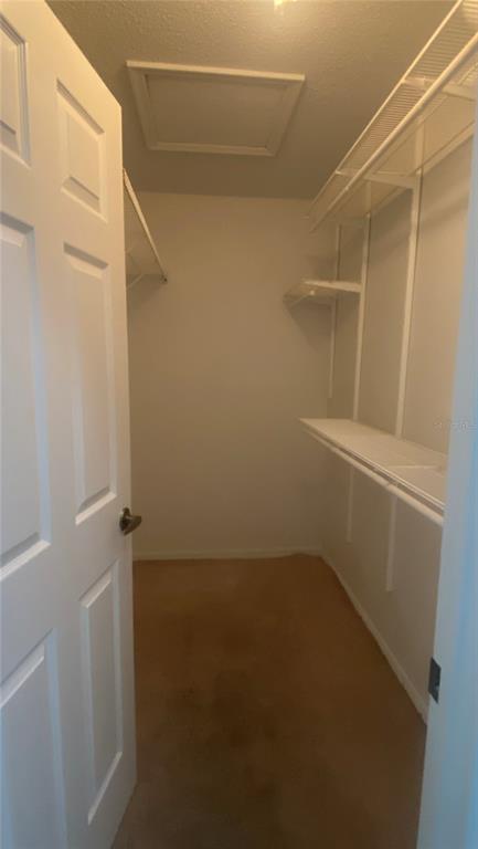 635 Rochester Loop Davenport, FL 33897 - Photo 11 of 22 a view of small space with racks on the wall