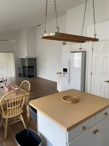a kitchen with a table and chairs