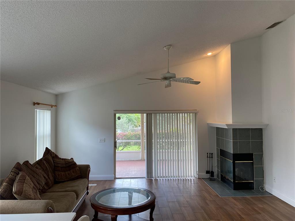 635 Rochester Loop Davenport, FL 33897 - Photo 20 of 22 a living room with furniture and a window