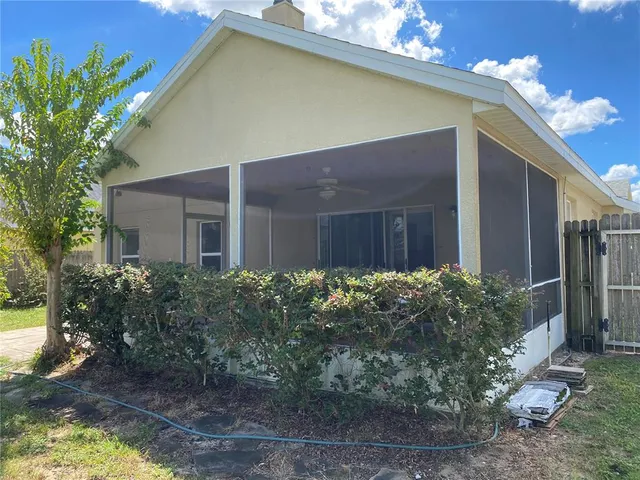 a front view of house along with yard and green space