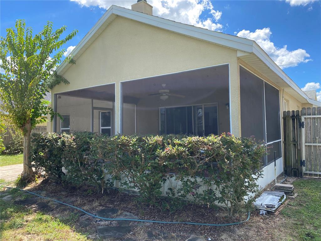 635 Rochester Loop Davenport, FL 33897 - Photo 3 of 22 a front view of house along with yard and green space