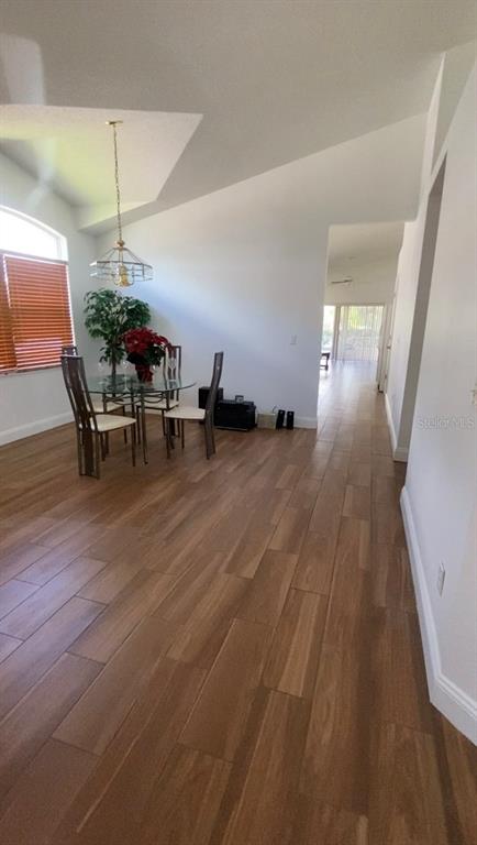 635 Rochester Loop Davenport, FL 33897 - Photo 7 of 22 a dining room with furniture and wooden floor