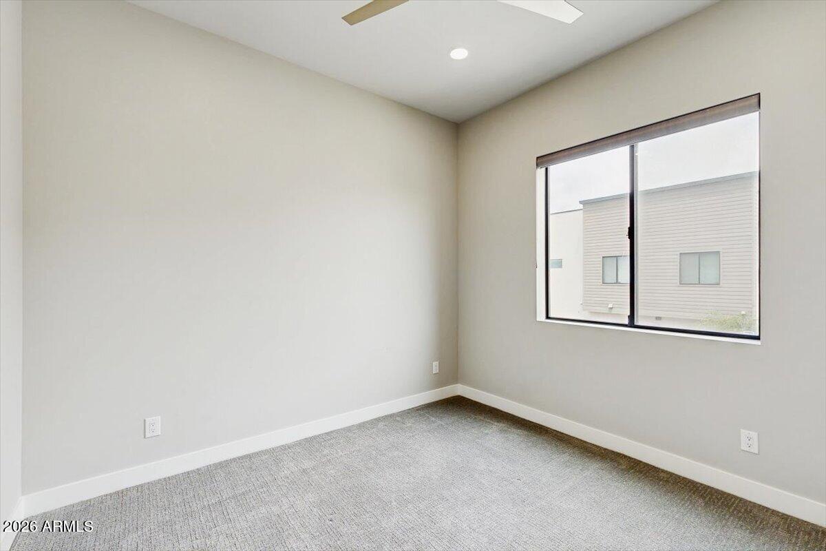 2645 East Osborn Road, Unit 3 Phoenix, AZ 85016 - Photo 11 of 14 an empty room with a window