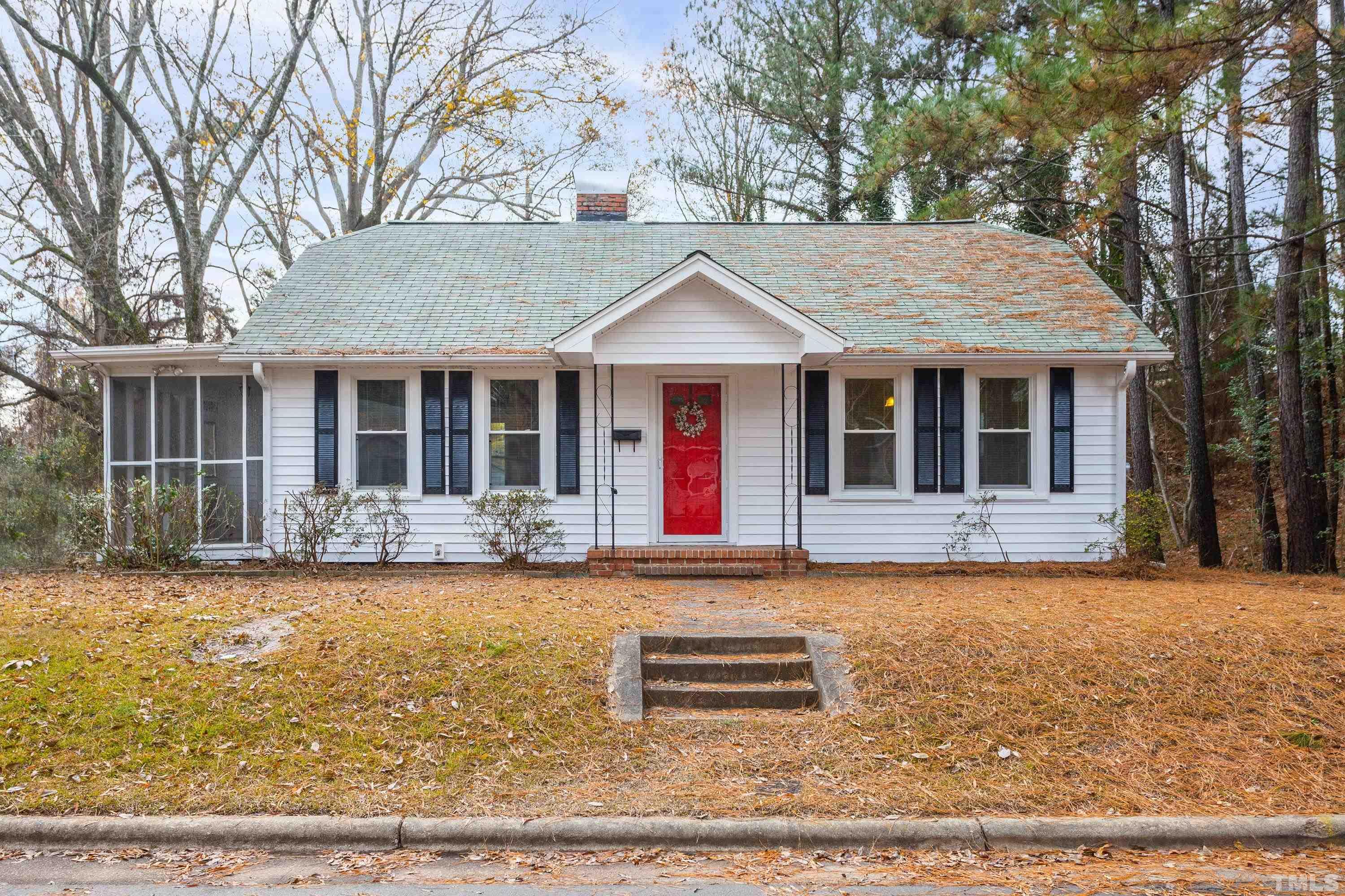 111 Turner Street Raleigh, NC 27607 - Photo 1 of 26 a front view of a house with garden