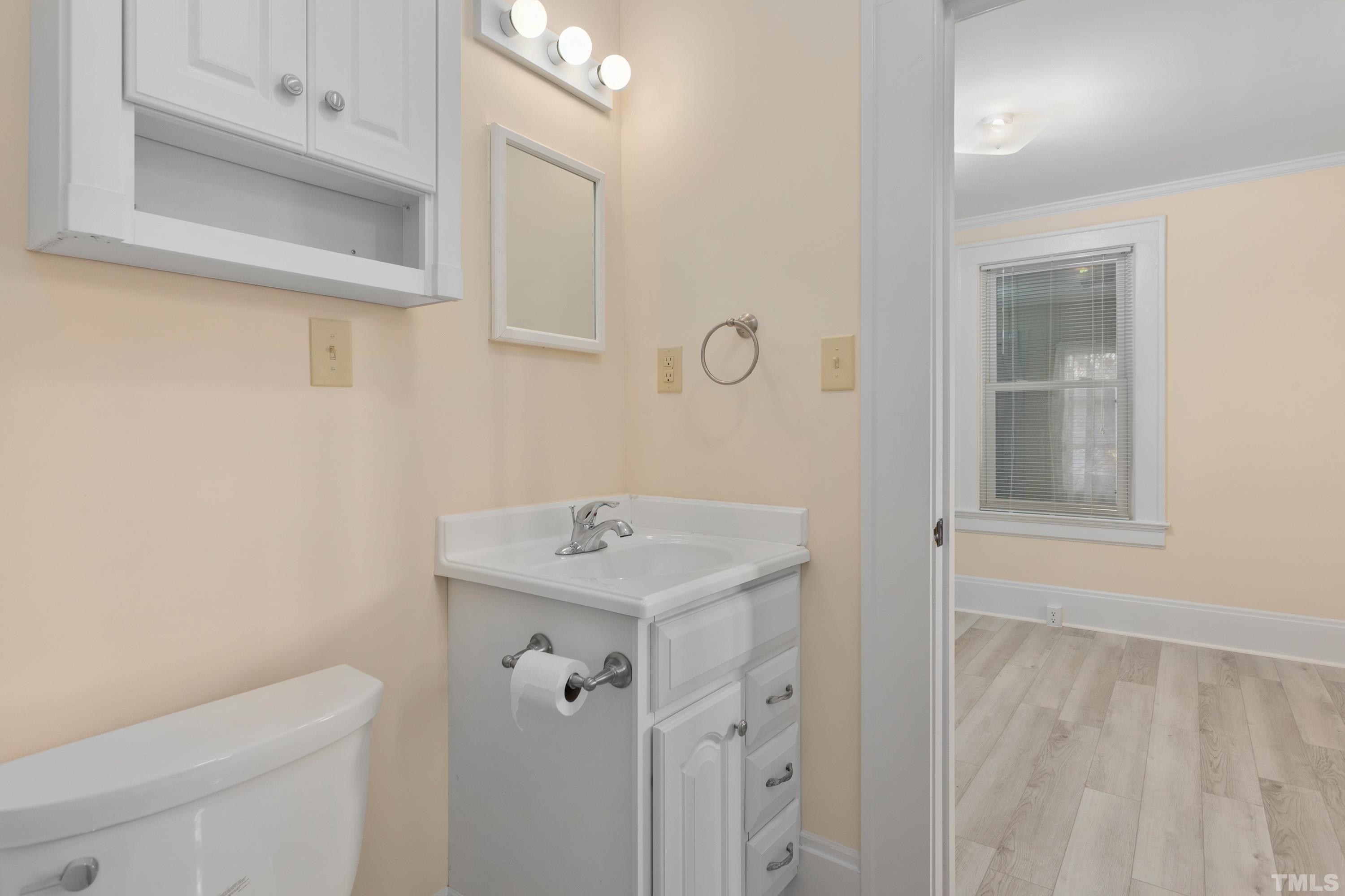 111 Turner Street Raleigh, NC 27607 - Photo 17 of 26 a bathroom with a sink a toilet and shower