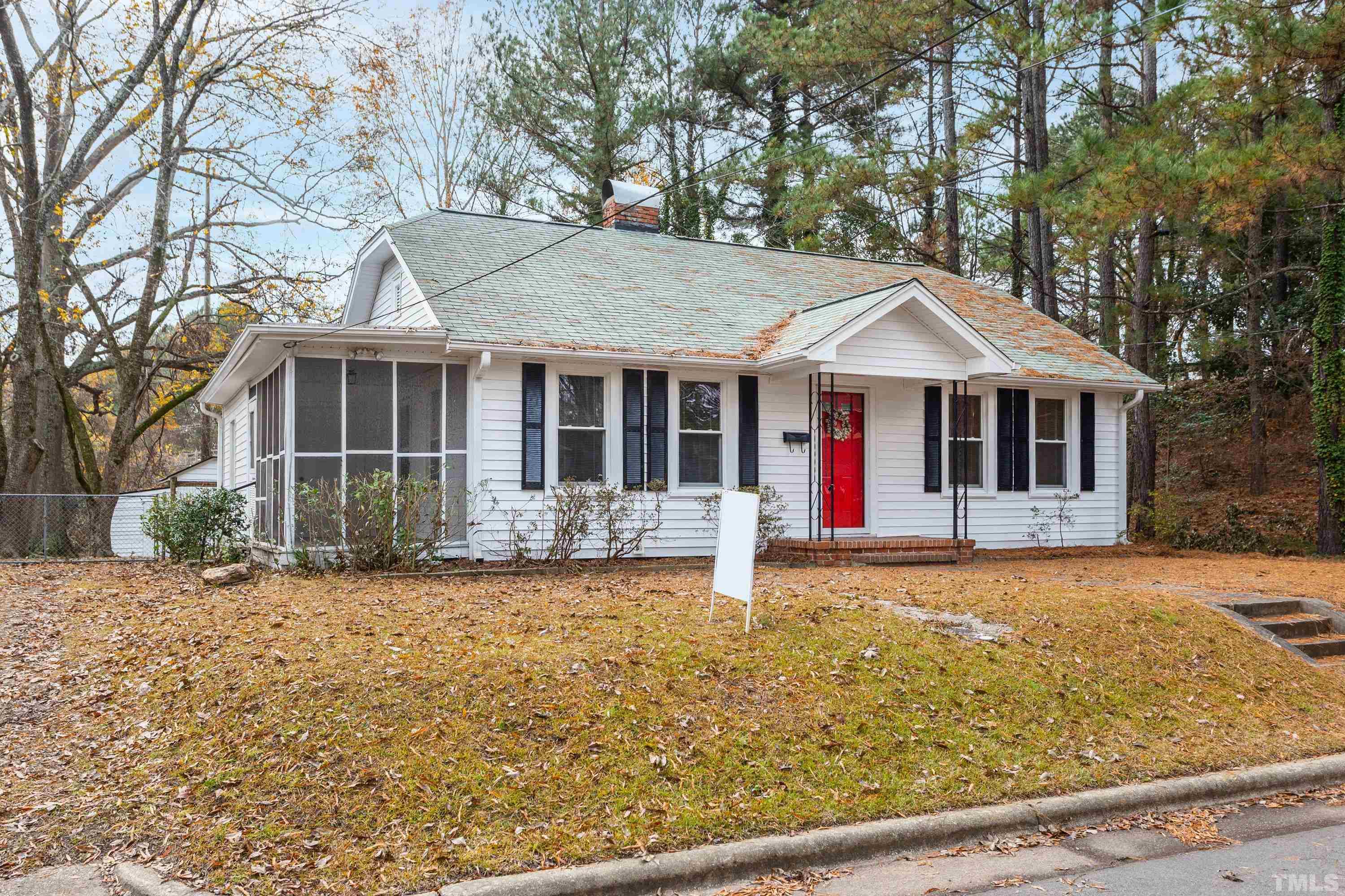 111 Turner Street Raleigh, NC 27607 - Photo 3 of 26 a front view of a house with a garden
