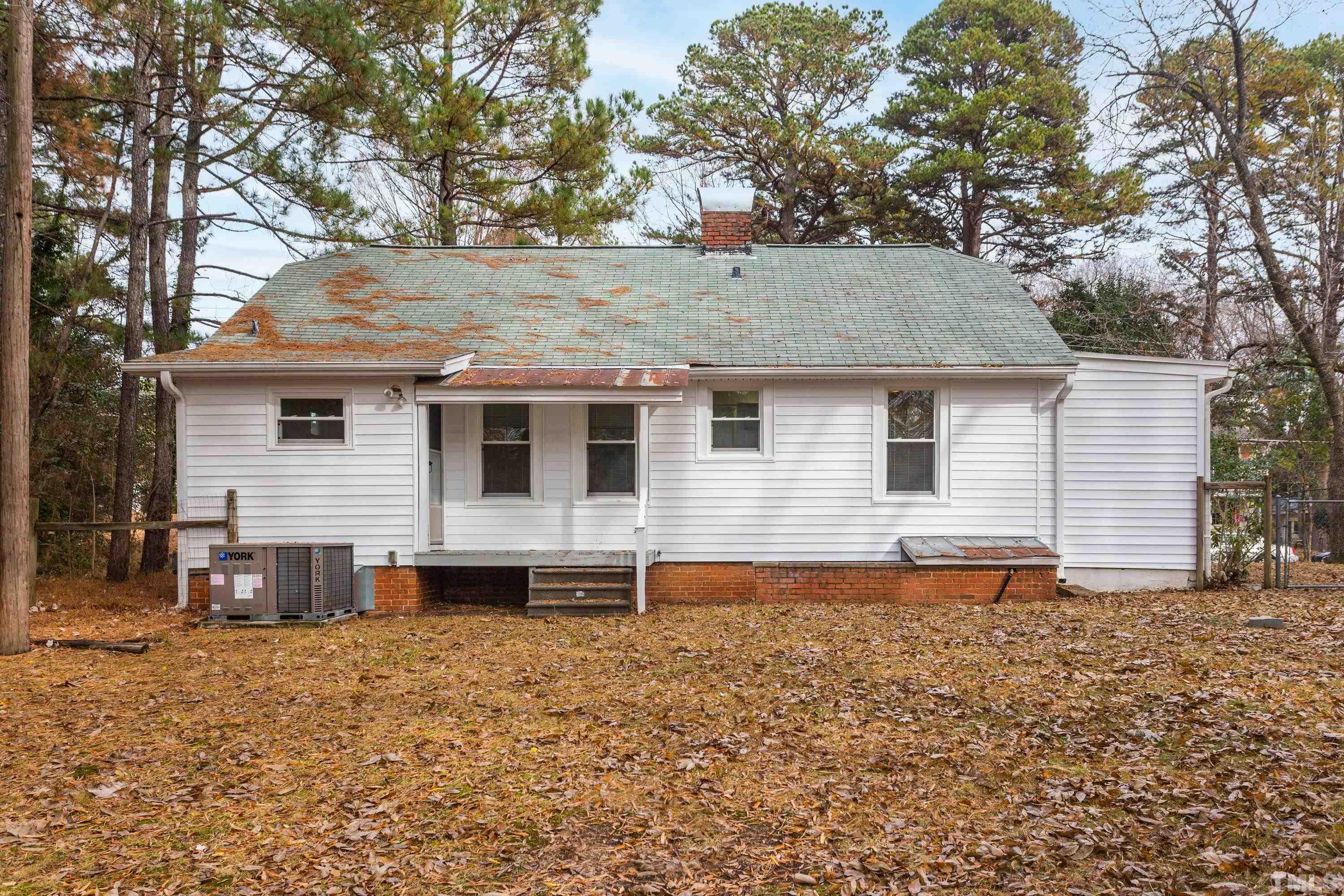 111 Turner Street Raleigh, NC 27607 - Photo 22 of 26 a front view of house with yard
