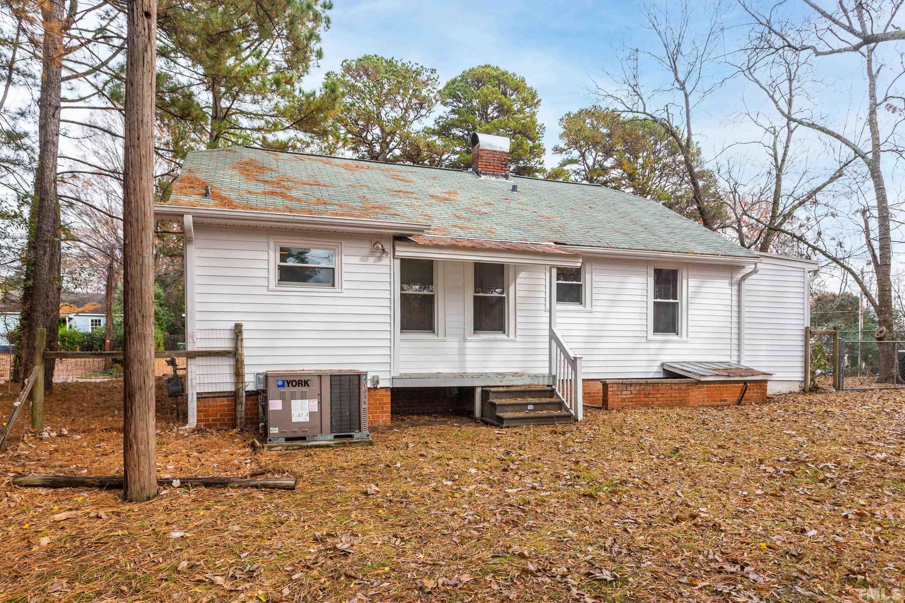 111 Turner Street Raleigh, NC 27607 - Photo 24 of 26 a view of a house with a yard and wooden fence
