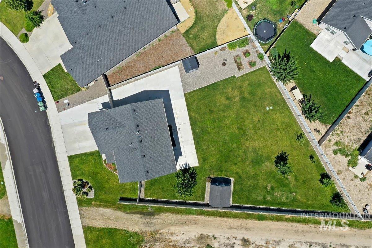 12310 West Hidden Point Drive Star, ID 83669 - Photo 33 of 48 Residential property with a dark gray shingle roof and a concrete driveway