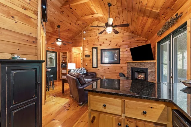 a view of a living room with furniture and a flat screen tv