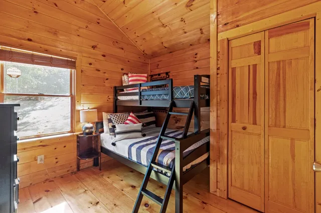 a bathroom with a toilet and a shower curtain