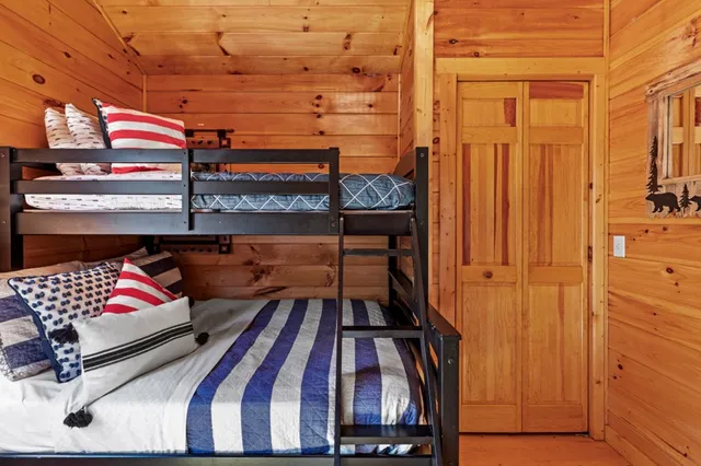 a bathroom with a sink a toilet and a window