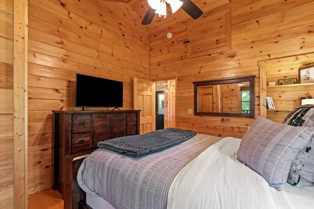 a view of balcony with wooden floor and fence