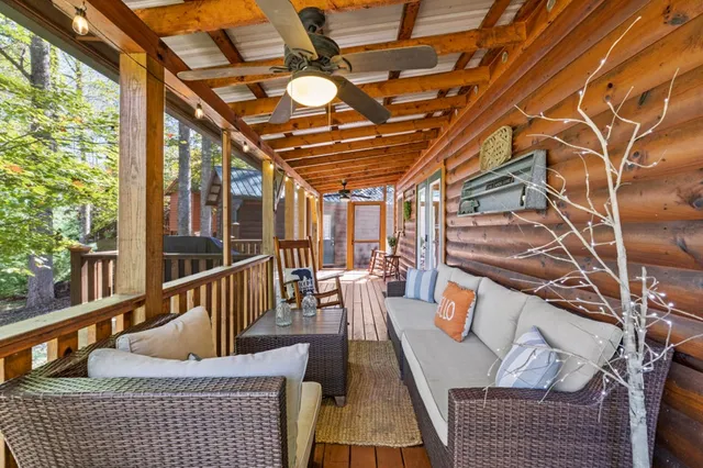 a view of a field with an ocean and trees