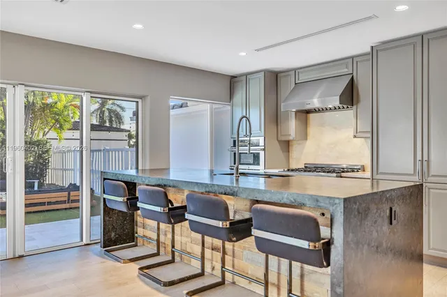 a living room with furniture fireplace and window