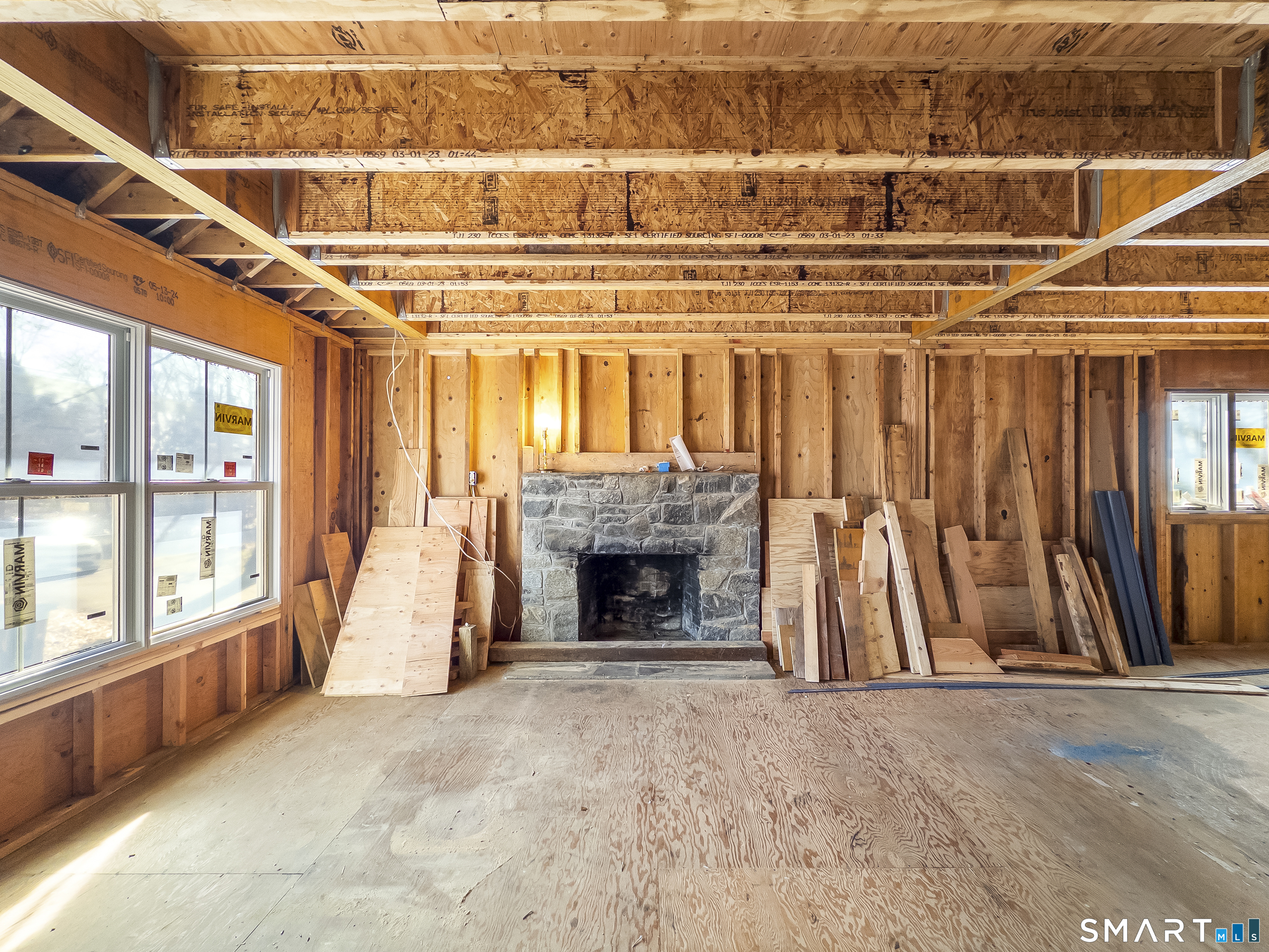 58 Grieb Road Wallingford, CT 06492 - Photo 8 of 36 a view of an empty room with wooden floor and a fireplace