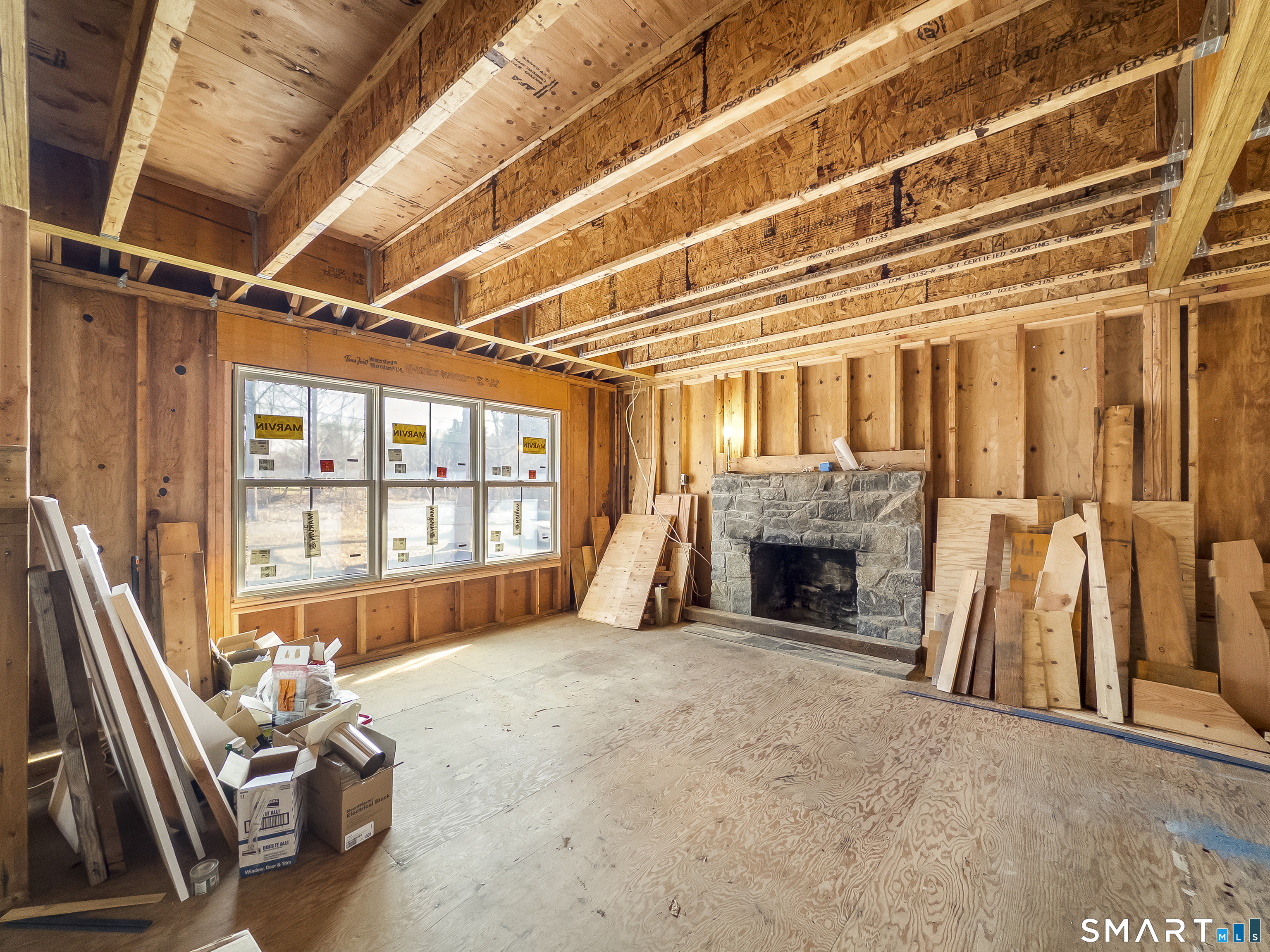 58 Grieb Road Wallingford, CT 06492 - Photo 9 of 36 a view of an empty room with fireplace and a window