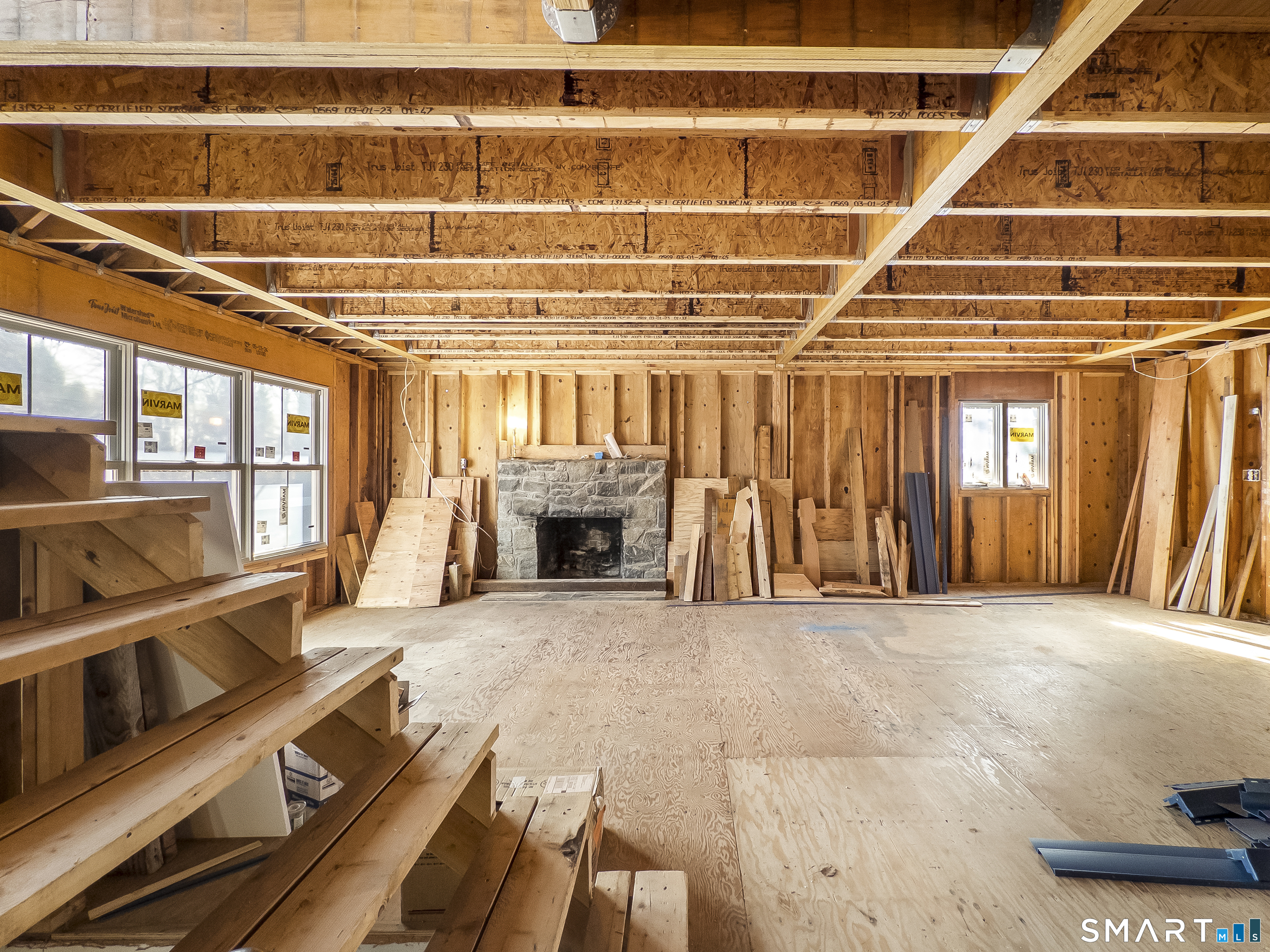 58 Grieb Road Wallingford, CT 06492 - Photo 10 of 36 a view of an empty room with wooden floor and a window