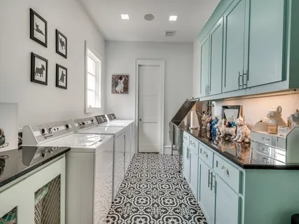 a kitchen with stainless steel appliances granite countertop a sink and cabinets