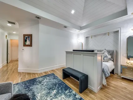 a bedroom with a bed and a couch