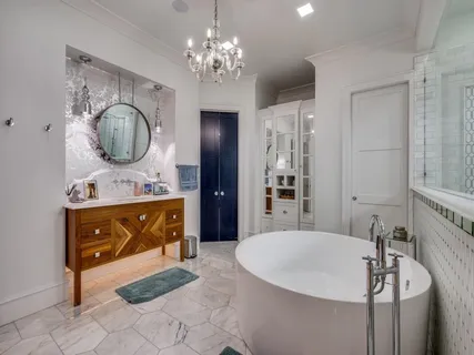 a bathroom with a sink double vanity and a mirror