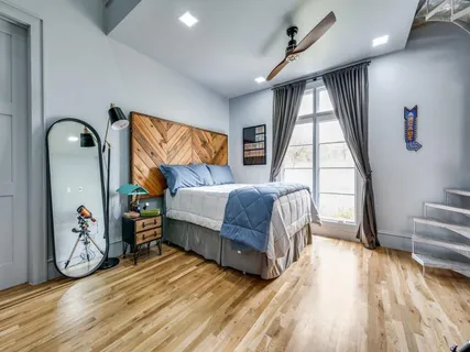 a bathroom with a toilet a sink and a mirror