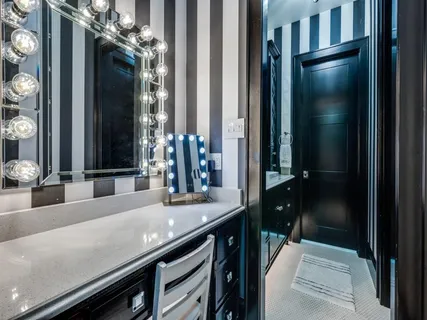 a living room with patio furniture and a potted plant